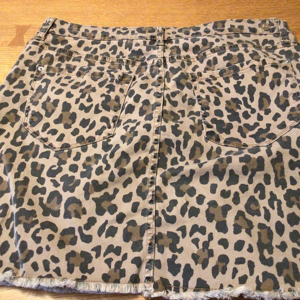 Leopard print jean skirt with frayed hem.  EUC